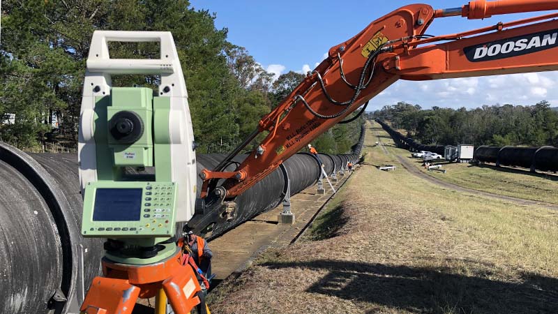Total station beside pipeline — construction survey set-out